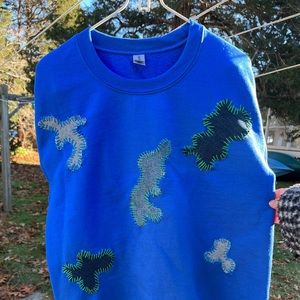 Champion hand embroidered cozy sweater